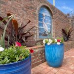 Flower-filled garden in front yard of traditional home in Jacksonville, Florida