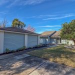 Sawgrass yard transformed from winter damage to a vibrant tropical landscape in Atlantic Beach, FL