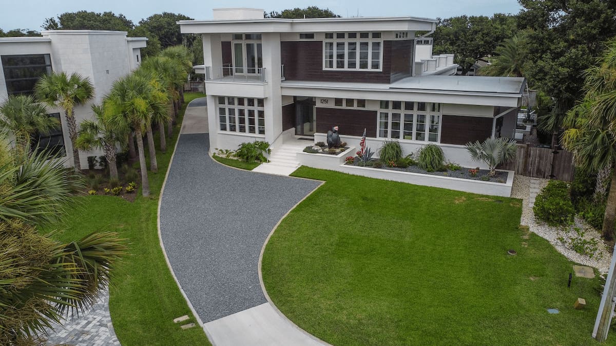 Modern home with St. Augustine grass and landscaped yard in Jacksonville, FL